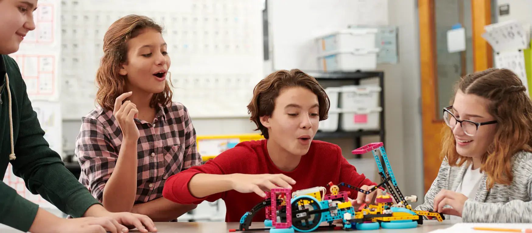 Students engaging with LEGO Education SPIKE Prime kits in a classroom setting, showcasing teamwork and creativity.