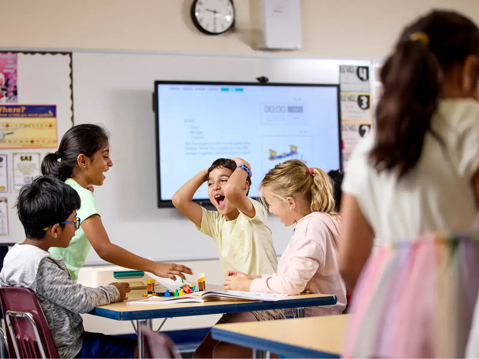 Children engaging in a fun classroom activity, showcasing creativity and collaboration with educational materials.