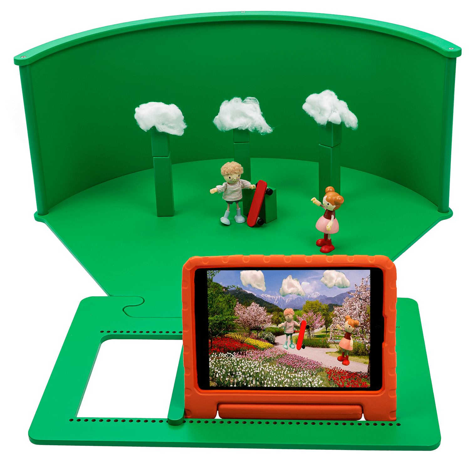 Tabletop greenscreen setup with figures and tablet showcasing imaginative role-play and creativity for children.