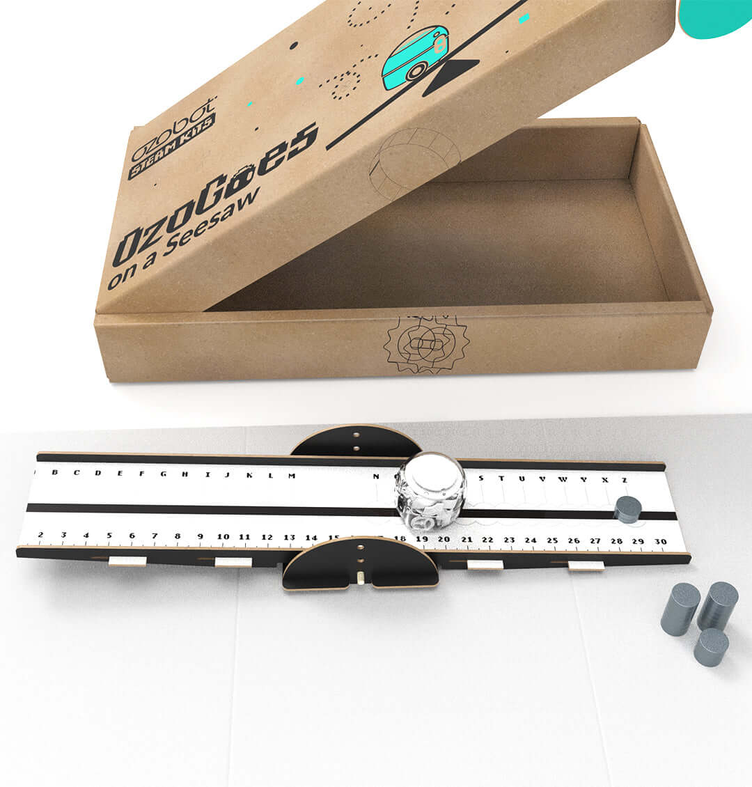 OzoGoes On A Seesaw kit featuring a box and seesaw base for learning STEAM concepts and leverage.