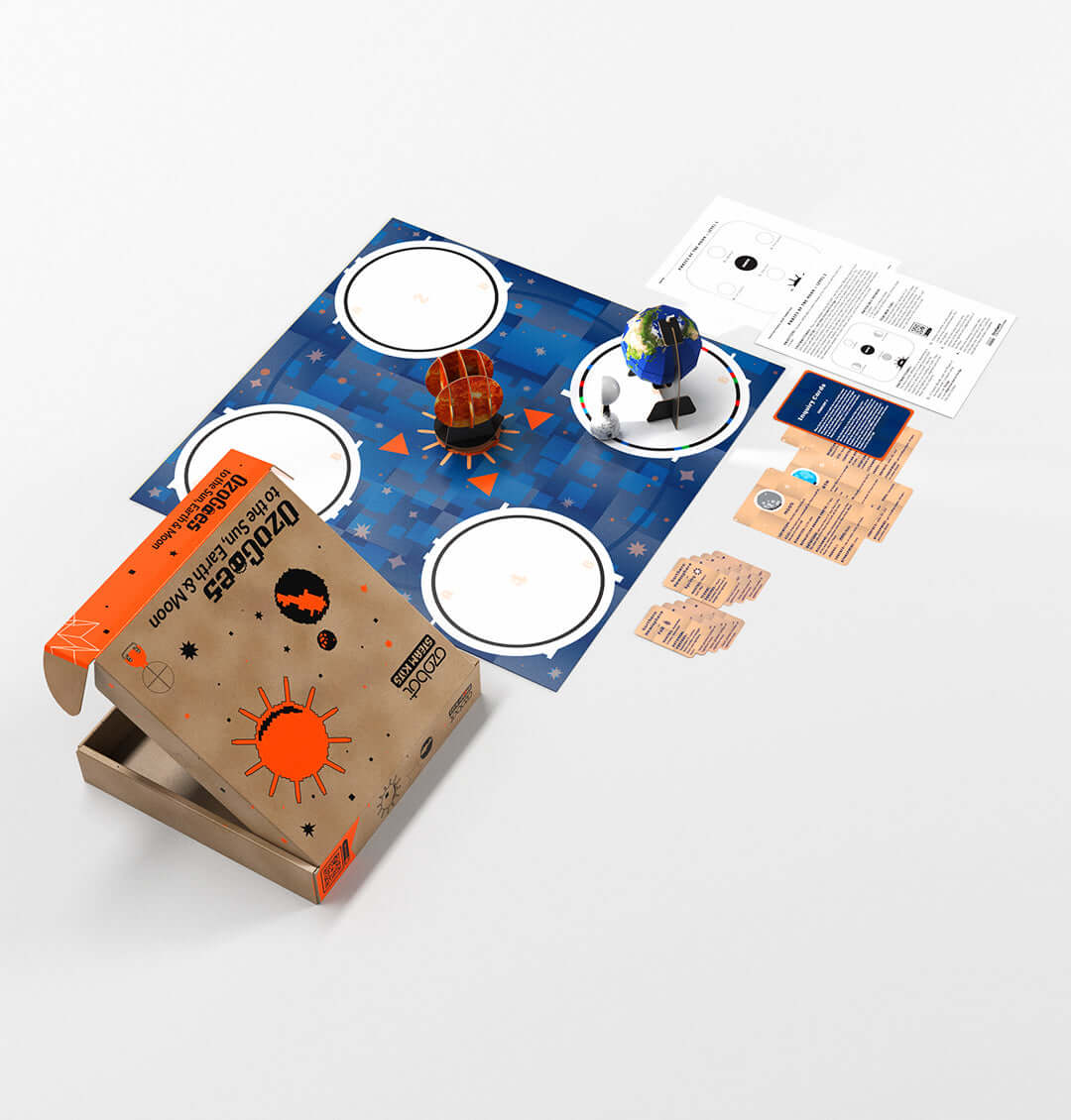 OzoGoes to the Sun, Earth & Moon STEAM kit with activity mat and cards for educational solar system exploration.