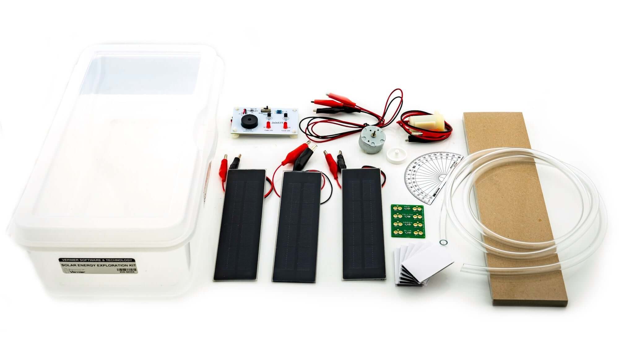 Solar Energy Exploration Kit components including solar panels, wires, a circuit board, and experimentation tools.