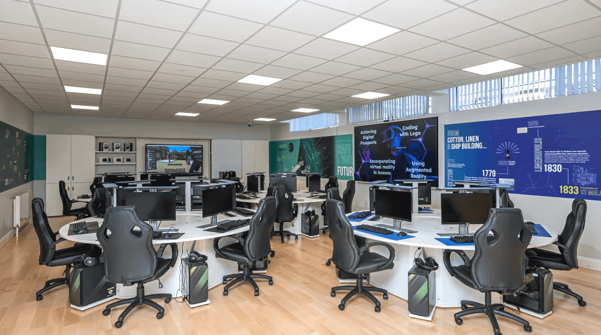 Modern office workspace with ergonomic chairs and multiple computer stations, ideal for tech and collaborative projects.