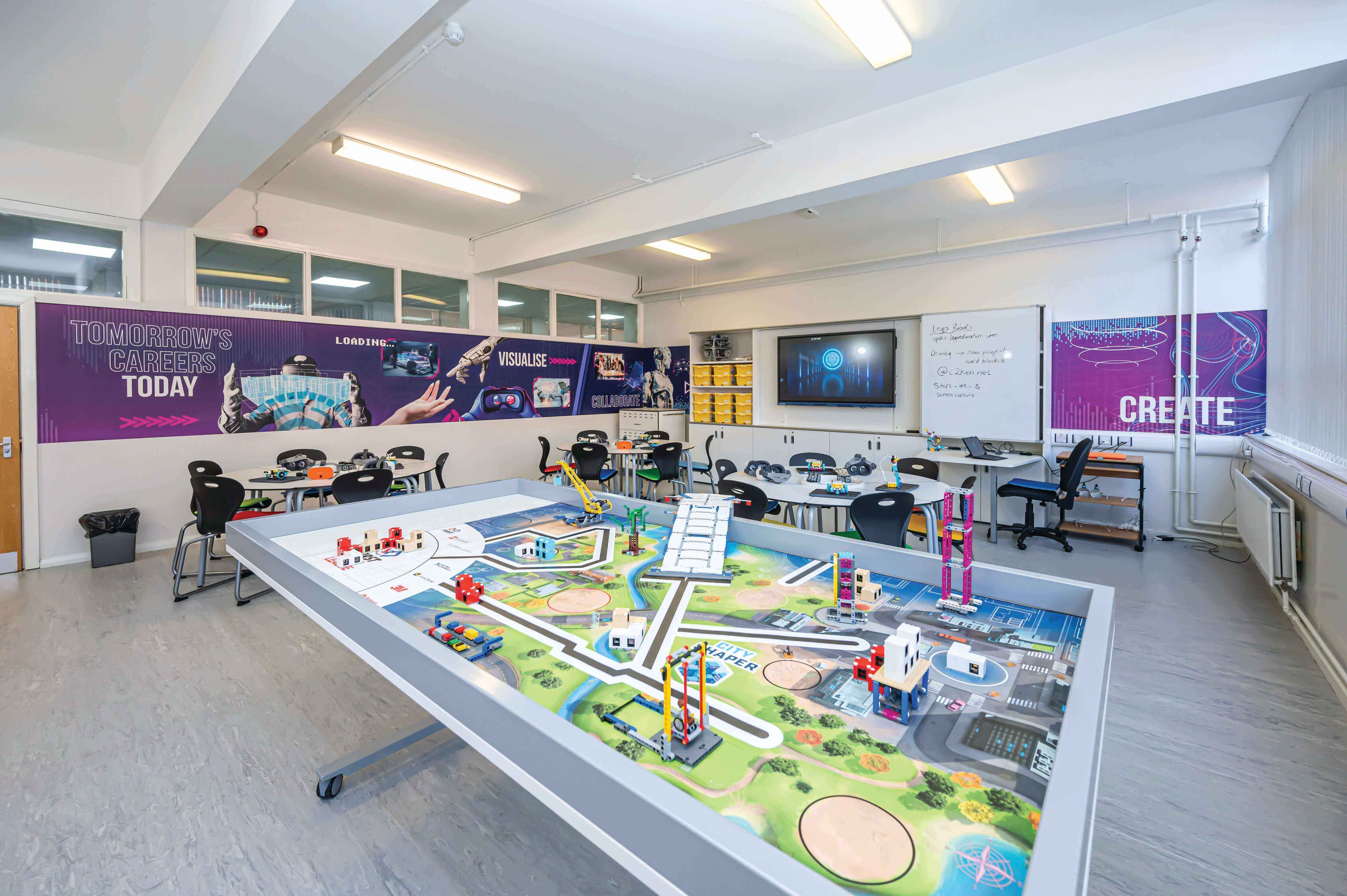 Modern classroom with collaborative learning setup and interactive displays, featuring a vibrant learning table.