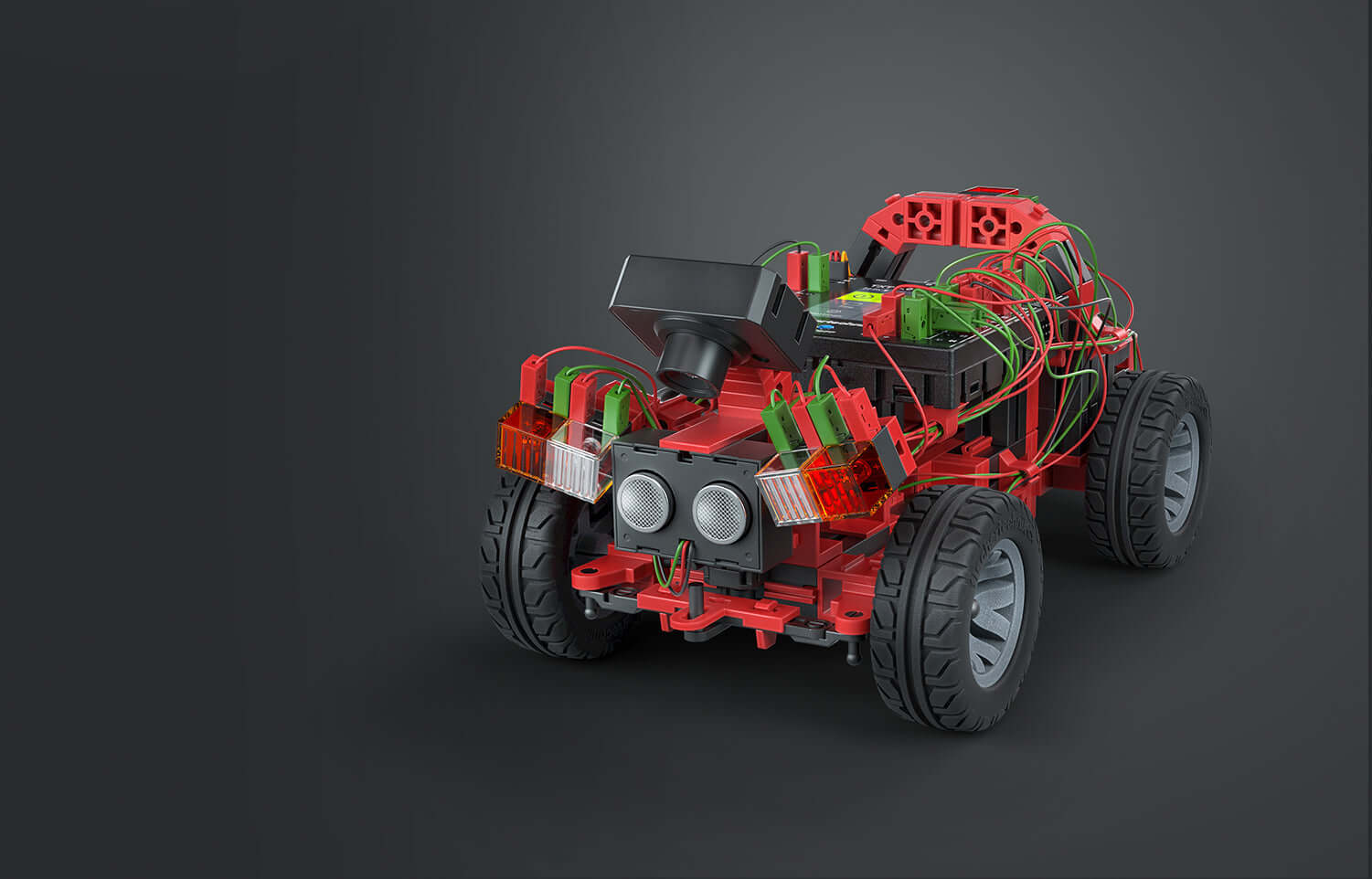 Autonomous driving add-on set for Robotics TXT 4.0, showcasing a red robotic car with visible wiring and sensors.