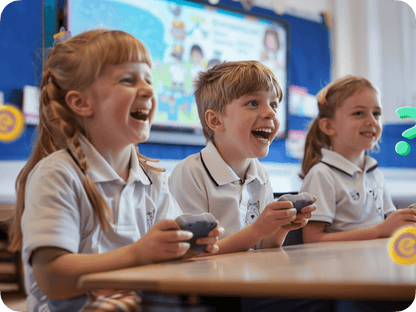 Students engaged in gamified learning with controllers, smiling and enjoying a Classwise educational activity.
