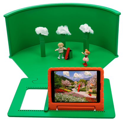 Tabletop greenscreen setup with figures and tablet showcasing imaginative role-play and creativity for children.