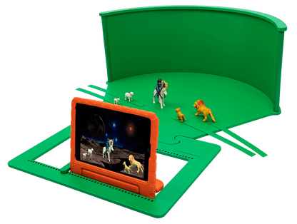 Child-friendly greenscreen setup with toy figures for imaginative role-play and digital creativity.