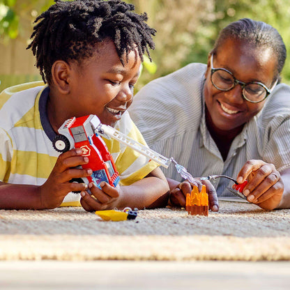 Child and adult joyfully playing with LEGO® City Fire Ladder Truck Toy, fostering imaginative play and bonding.