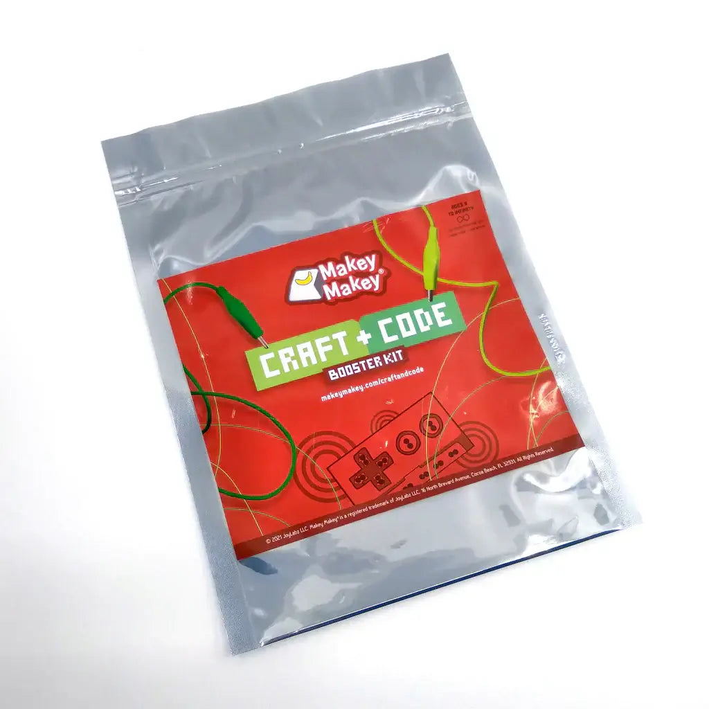 Makey Makey Craft + Code Booster Kit packaging featuring bright colors and interactive design elements.