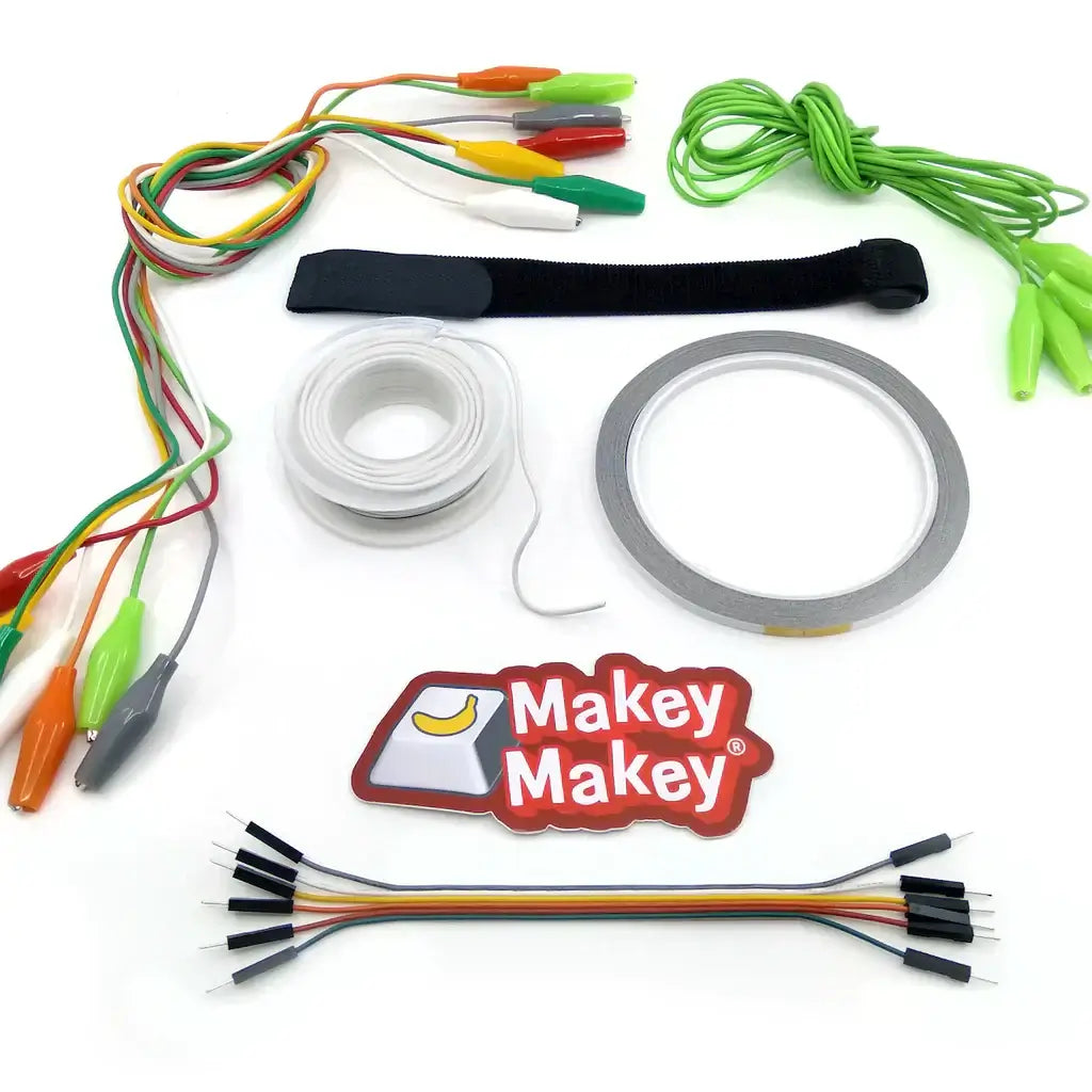 Components of the Makey Makey Get Up + Go! Booster Kit, including cables, tape, and connectors.