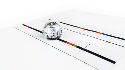 Ozobot Evo robot on color-coded magnets for interactive coding education and speed learning.