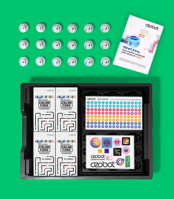 Ozobot Evo Classroom Kit with markers, stickers, and user guide on a green background.