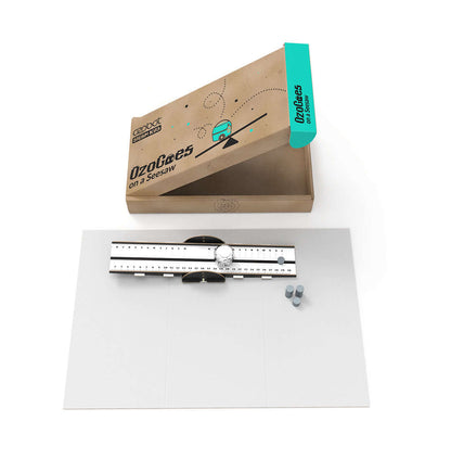 OzoGoes On A Seesaw STEAM kit showing box and parts on a white backdrop for educational fun.