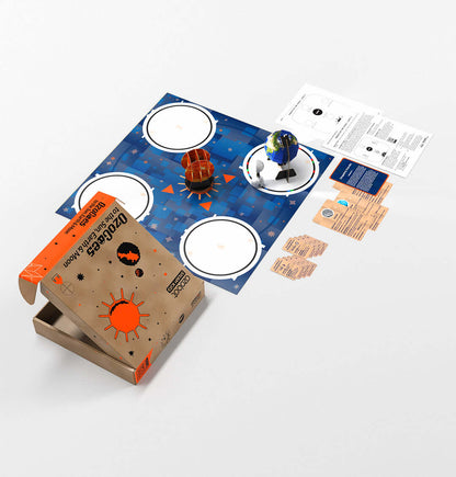 OzoGoes to the Sun, Earth & Moon STEAM kit with activity mat and cards for educational solar system exploration.